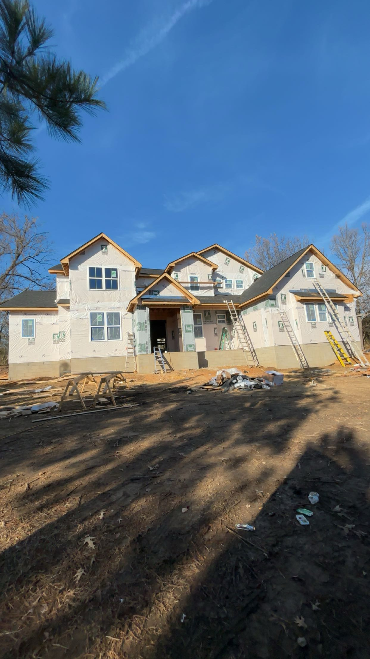 Custom home build with wrap exterior in progress
